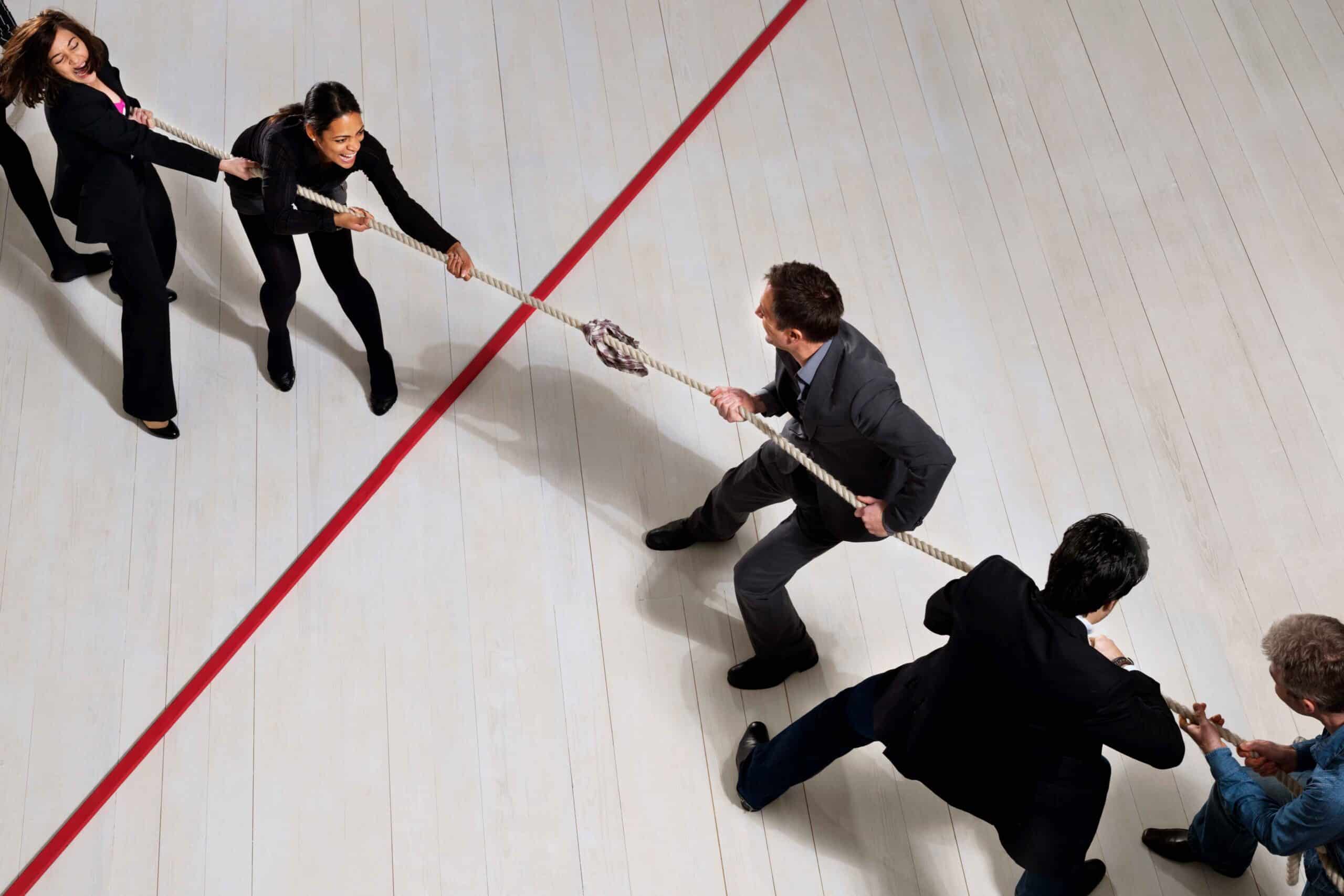 business-people-playing-tug-of-war-2024-11-03-04-24-26-utc_11zon