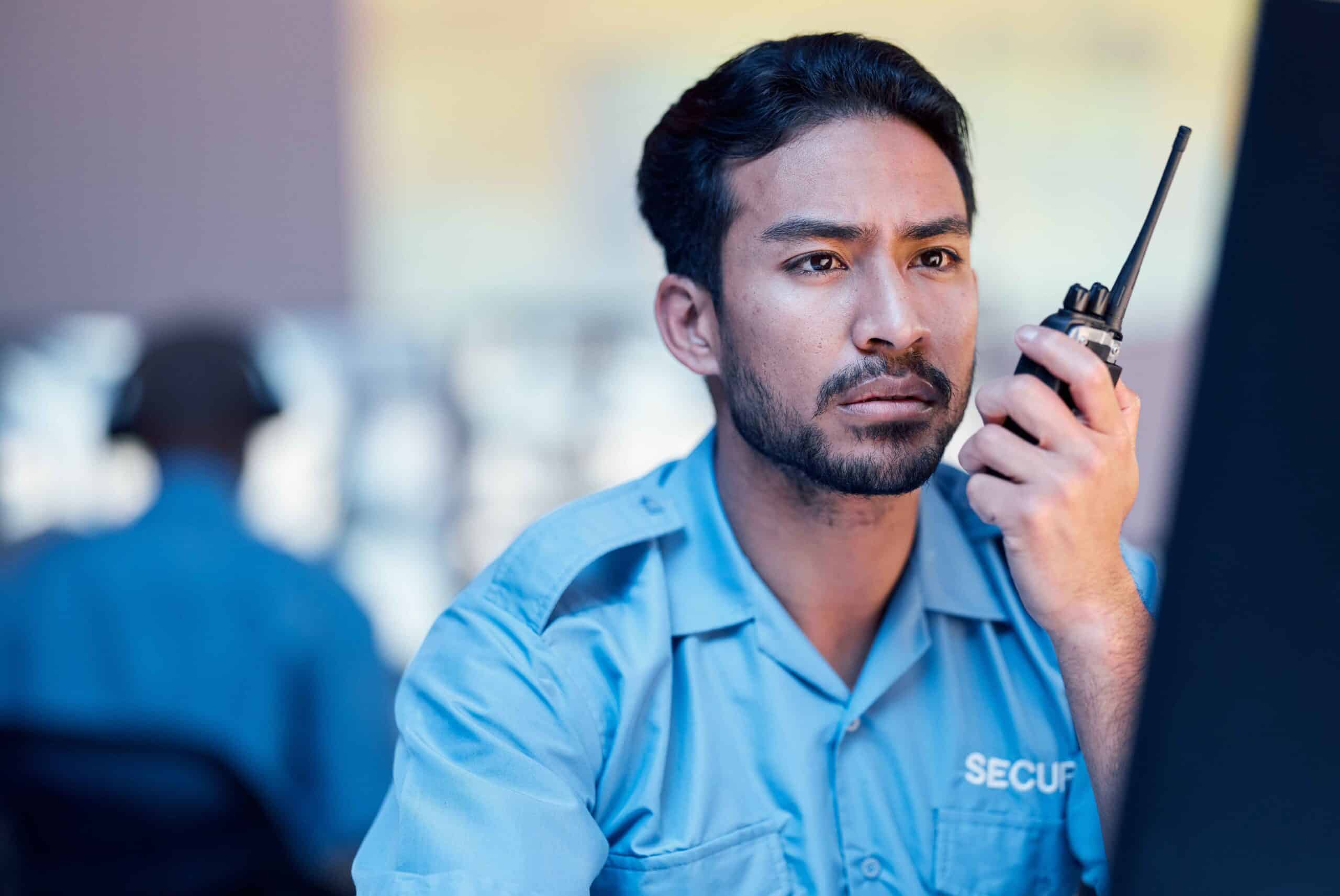 security-dispatch-man-computer-and-walkie-talkie-2025-04-06-09-07-13-utc_11zon