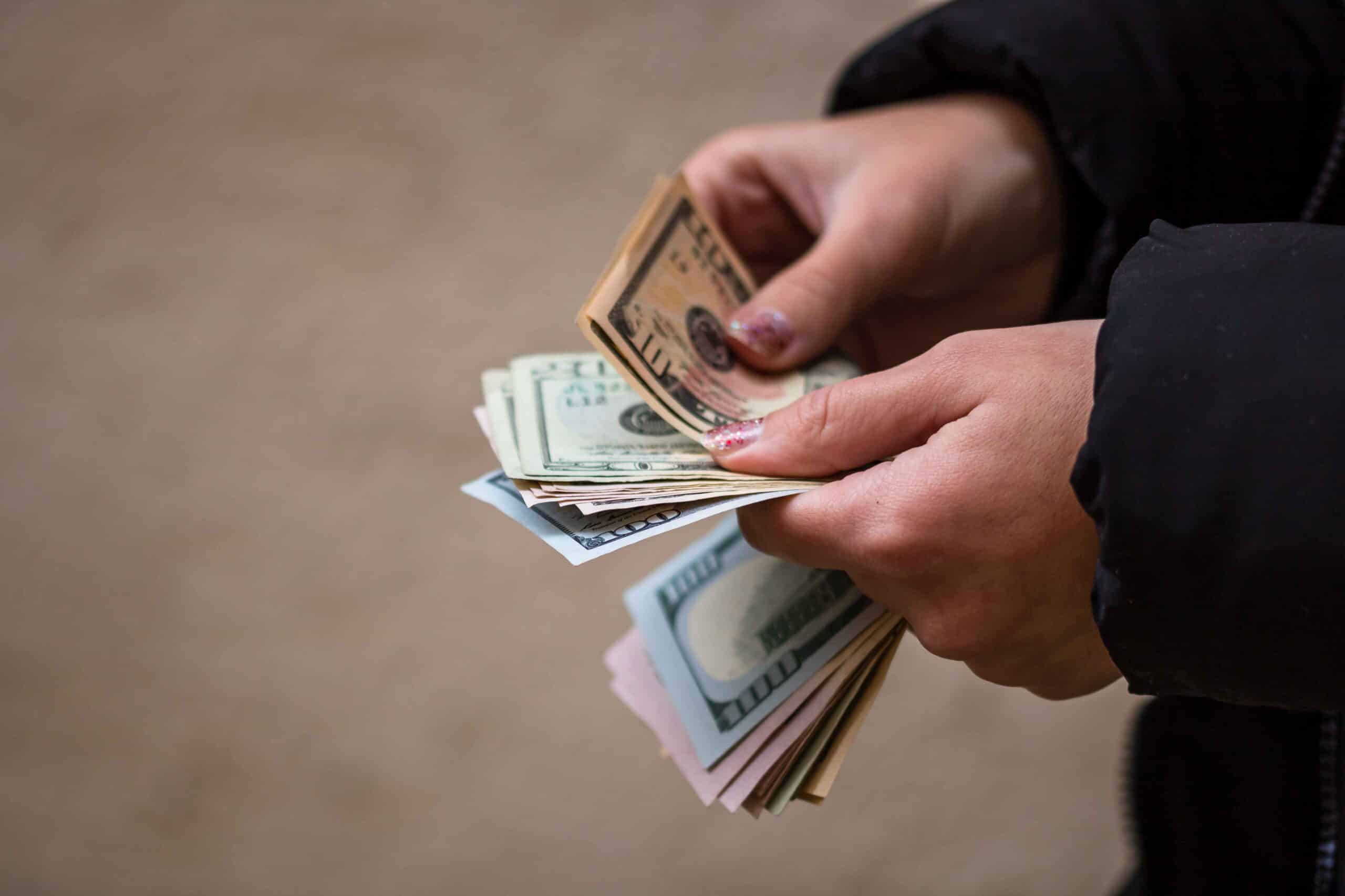 selective-focus-shot-of-female-hands-counting-us-d-2025-02-03-07-47-51-utc_11zon